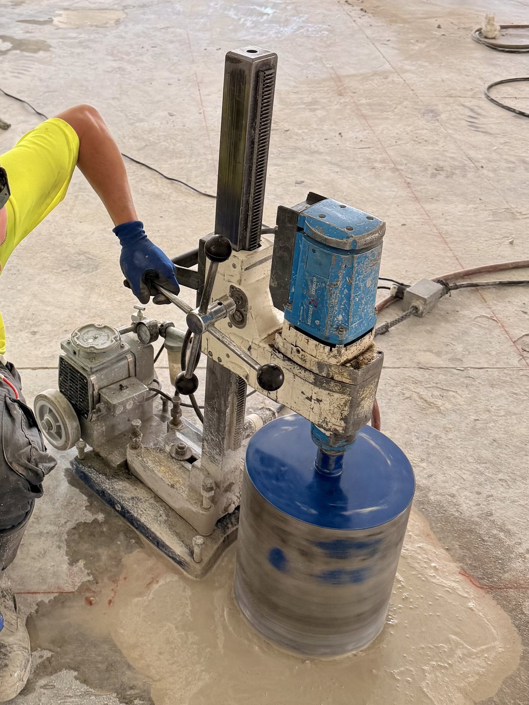 Core drilling a large hole through a concrete floor in the Salt Lake area